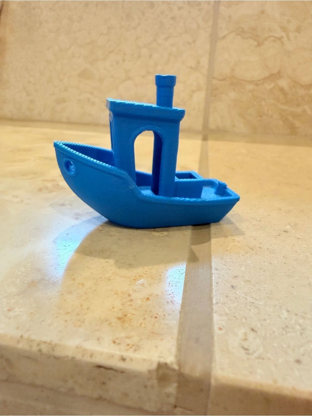 Small 3D-Printed Toy Boat in Bright Blue